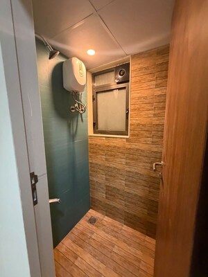 Bathroom in 1 BHK Apartment at Lodha Quality Home Tower 2, Majiwada – for Rent