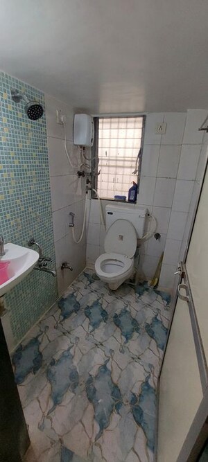 Bathroom in 2 BHK Apartment at Manisha Purti CHS, Goregaon West – for Rent
