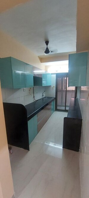 Kitchen in 2 BHK Apartment at Manisha Purti CHS, Goregaon West – for Rent