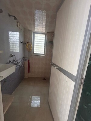 Bathroom in 1 BHK Apartment at Jalmeena CHS, Vile Parle East – for Rent