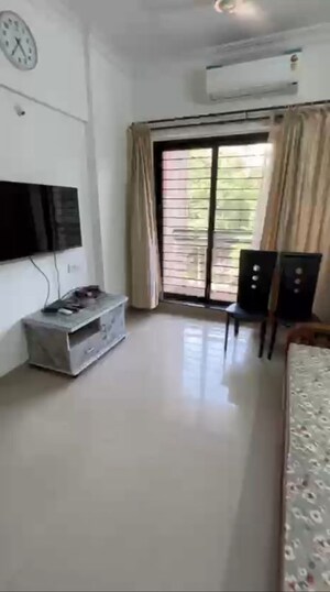 Living Room in 1 BHK Apartment at K Raheja Heights, Malad East – for Rent