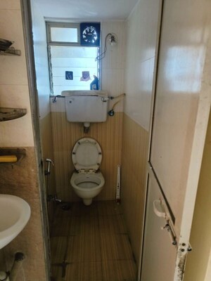 Bathroom in 1 BHK Apartment at Raunak Unnathi Woods Phase 7 A And B, Ghodbunder Road – for Sale