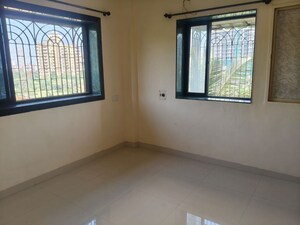 Room in 2 BHK Apartment at Ganpati CHS, Nerul Sector 19 – for Rent
