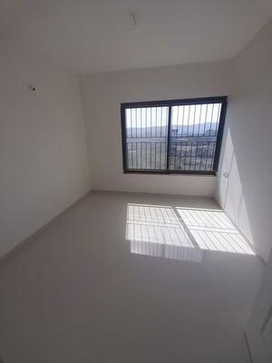 Bedroom in 2 BHK Apartment at Kumar Palmspring Towers, Undri – for Rent