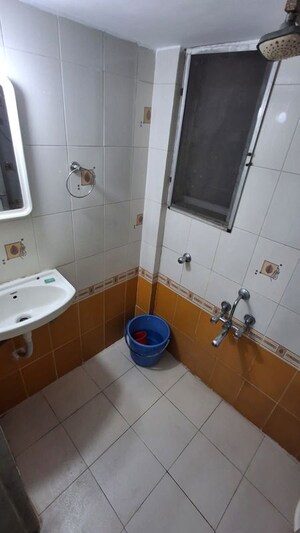 Bathroom in 1 BHK Apartment at Puranik Hometown, Ghodbunder Road – for Rent