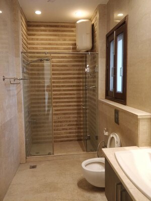 Bathroom in 4 BHK Apartment at Defence Colony – for Rent