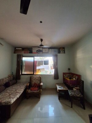Living Room in 1 BHK Apartment at Raunak Charnamrut CHS, Ghodbunder Road – for Rent