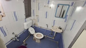 Bathroom in 1 BHK Apartment at Raunak Charnamrut CHS, Ghodbunder Road – for Rent