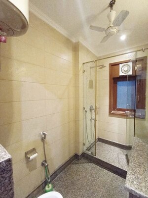 Bathroom in 3 BHK Apartment at Pamposh Enclave – for Rent