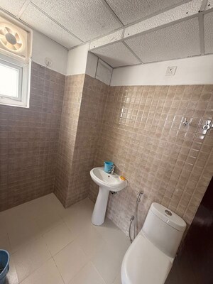 Bathroom in 2 BHK Apartment at Tulsiani Urban Woods, Sushant Golf City – for Rent
