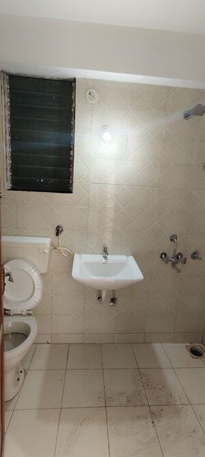 Bathroom in 2 BHK Apartment at Tanvi Eminence, Mira Road – for Rent
