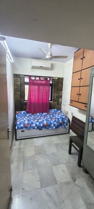 Bedroom in 2.5 BHK Apartment at Satellite Garden, Goregaon East – for Rent