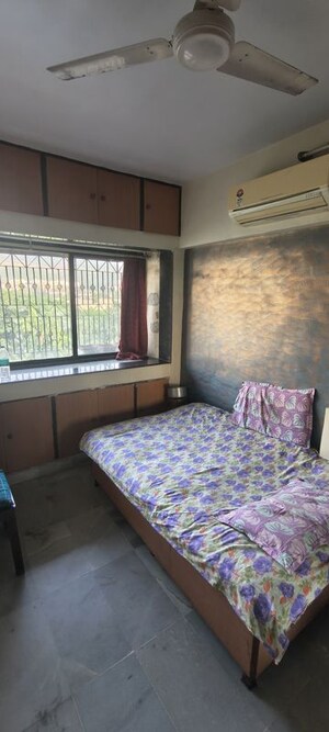 Bedroom in 2.5 BHK Apartment at Satellite Garden, Goregaon East – for Rent