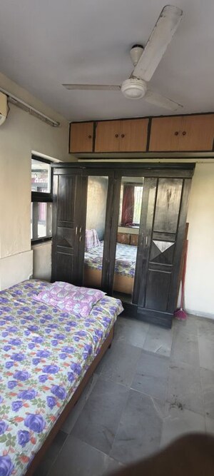 Bedroom in 2.5 BHK Apartment at Satellite Garden, Goregaon East – for Rent