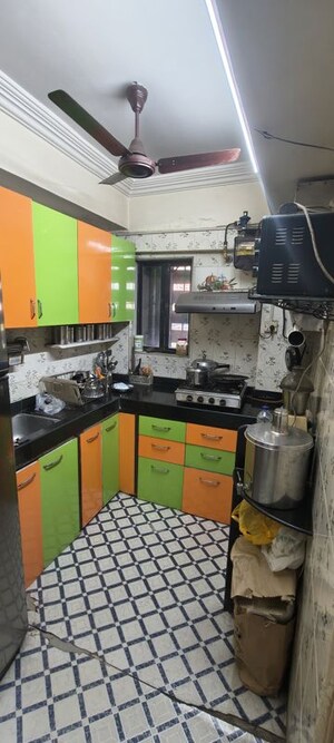 Kitchen in 2.5 BHK Apartment at Satellite Garden, Goregaon East – for Rent