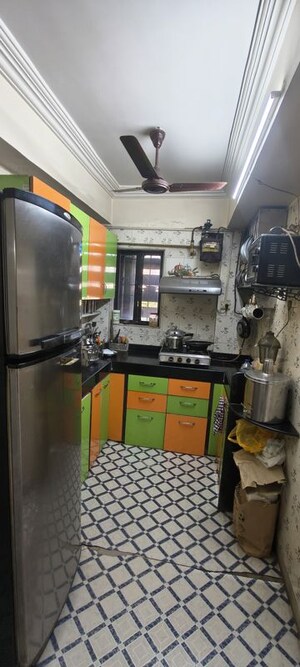 Kitchen in 2.5 BHK Apartment at Satellite Garden, Goregaon East – for Rent