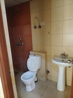 Bathroom in 2 BHK Apartment at Mahagun My Woods, Sector 16c Greater Noida – for Rent