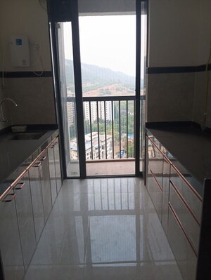 Kitchen in 2 BHK Apartment at Damji Shamji Mahavir Vista Point, Pokhran Road No Two – for Rent