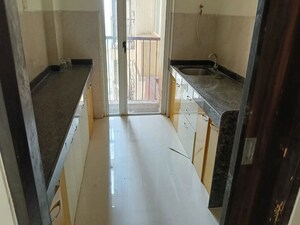 Kitchen in 1.5 BHK Apartment at Marathon Nexzone, New Panvel – for Rent