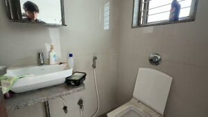 Bathroom in 2 BHK Apartment at Neminath Avenue, Andheri West – for Sale