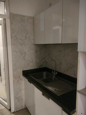 Kitchen in 3 BHK Apartment at Gaur Sportswood, Sector 79 – for Rent