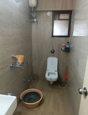 Bathroom in 1 BHK Apartment at Cosmos Jewels, Ghodbunder Road – for Rent