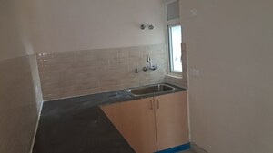 Kitchen in 3 BHK Apartment at Amrapali Dream Valley – for Sale
