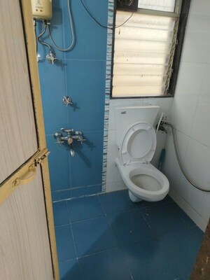 Bathroom in 2 BHK Apartment at Vijay Galaxy, Waghbil – for Rent