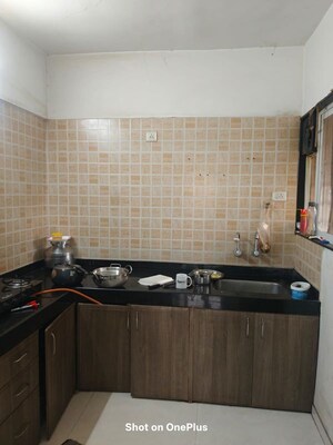 Kitchen in 2 BHK Apartment at GK Rose Mansion, Punawale – for Rent