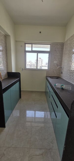 Kitchen in 2 BHK Apartment at Navkamal Pushpa Apartment, Naupada – for Rent