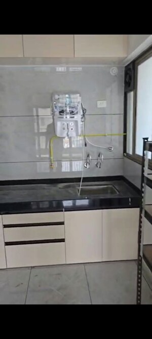 Kitchen in 3 BHK Apartment at Renuka Panchtattva, Tathawade – for Rent