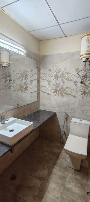 Bathroom in 1 RK Apartment at Paramount Golf Foreste Apartments, Zeta I Greater Noida – for Rent