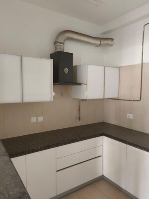 Kitchen in 3.5 BHK Apartment at Microtek Greenburg, Sector 86 – for Rent