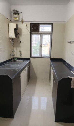 Kitchen in 2 BHK Apartment at Cosmos Classique, Ghodbunder Road – for Rent