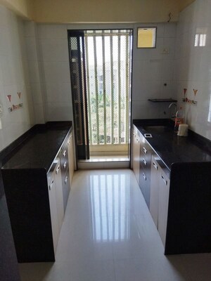 Kitchen in 2 BHK Apartment at Poonam Heights Virar, Virar West – for Rent