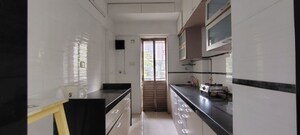 Kitchen in 2 BHK Apartment at Andheri CHS, Andheri West – for Rent