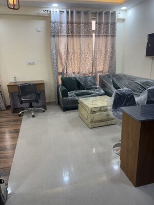 Living Room in 1 BHK Apartment at Supertech Czar Suites, Omicron I Greater Noida – for Rent
