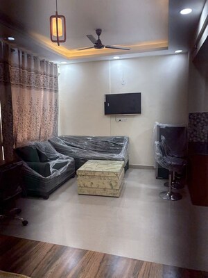 Living Room in 1 BHK Apartment at Supertech Czar Suites, Omicron I Greater Noida – for Rent