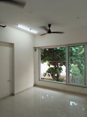 Living Room in 1 BHK Apartment at Ruparel Elara, Kandivali West – for Rent
