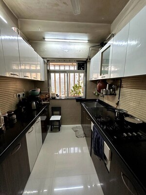 Kitchen in 2 BHK Apartment at Romell Diva, Malad West – for Sale