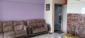Living Room in 2 BHK Apartment at Shree Venkatesh Graffiti Glover, Keshav Nagar – for Rent